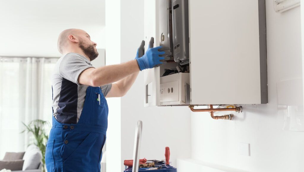 Engineer fixing a boiler